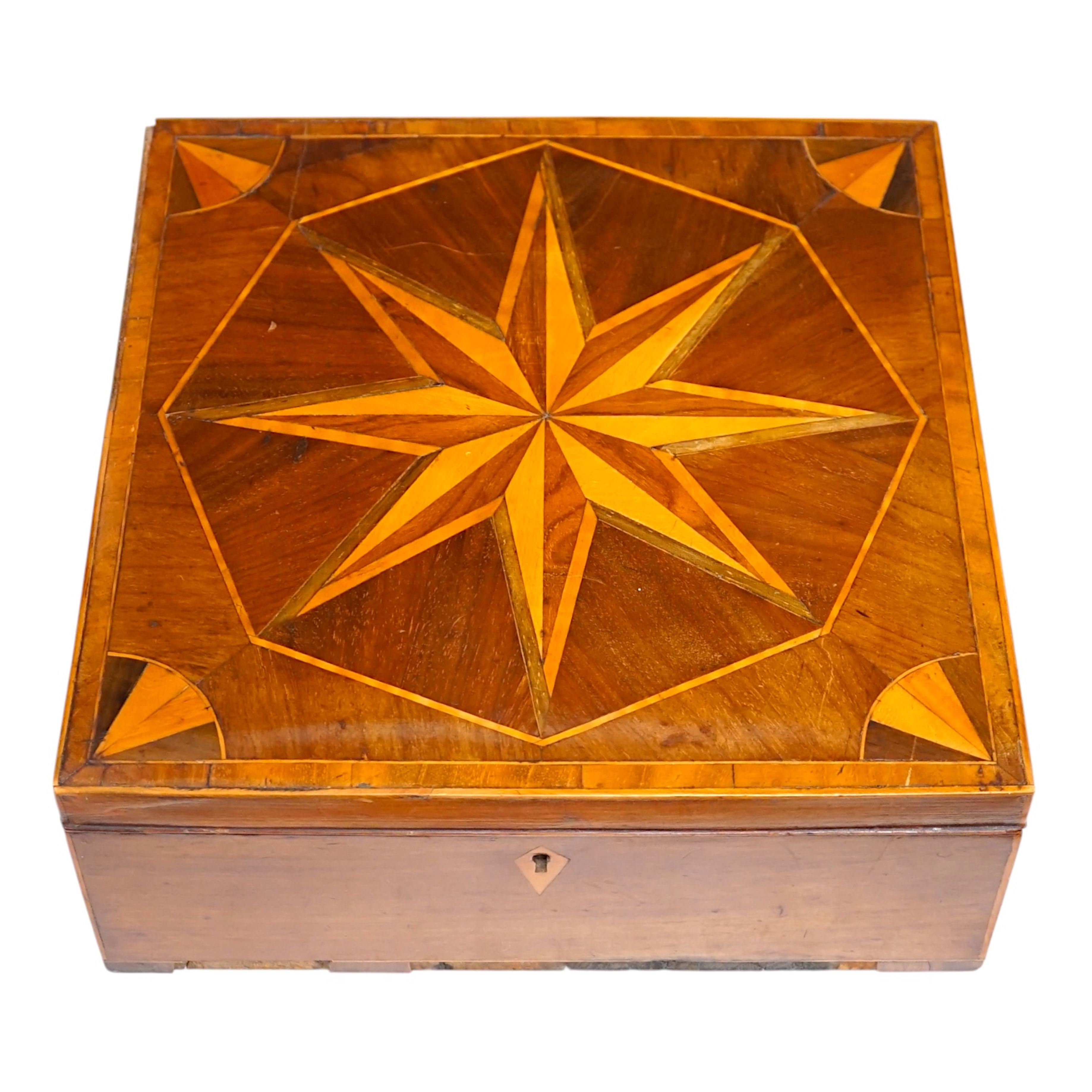 An early 19th century wood parquetry specimen box decorated with a star design top, 26cm wide, 10cm high, 26.5cm deep. Condition - fair